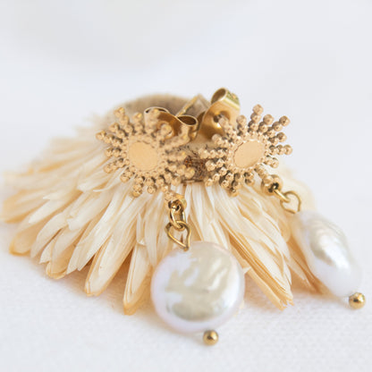 Gold sunburst earrings with baroque pearl drops