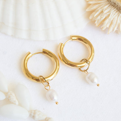 Gold hoop earrings with pearl drops