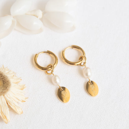 Gold hoop earrings with pearls and flower charm