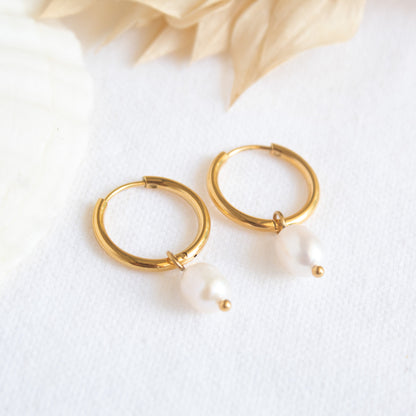 Gold hoop earrings with pearl drops
