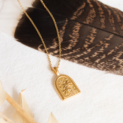 Gold Oasis Necklace with palm tree design
