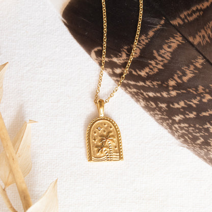 Gold Oasis Necklace with palm tree and star design