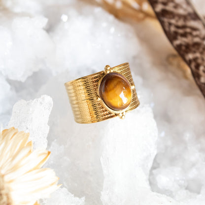 Gold ring with textured band and tiger's eye stone