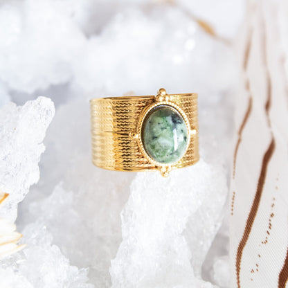 Gold ring with oval African turquoise stone
