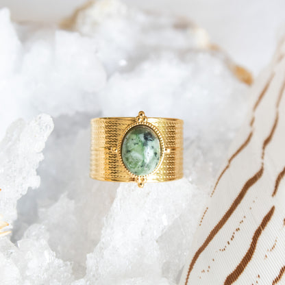 Gold ring with oval African turquoise stone