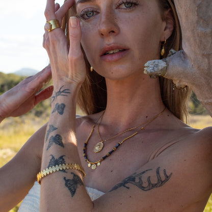 Gold Etheria Necklace with sunburst pendant