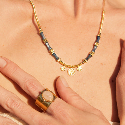 Etheria gold beaded necklace with blue accents
