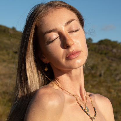 Woman wearing Cosmic Aura Necklace