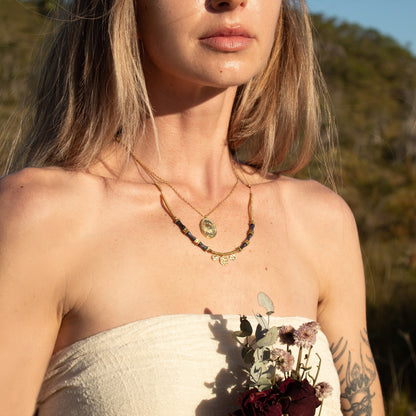 Gold Cosmic Aura Necklace with blue beads
