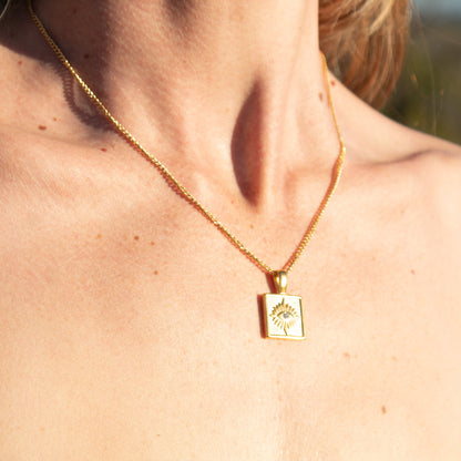 Gold necklace with square evil eye pendant