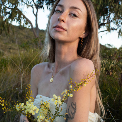 Gold Oasis necklace with floral charm