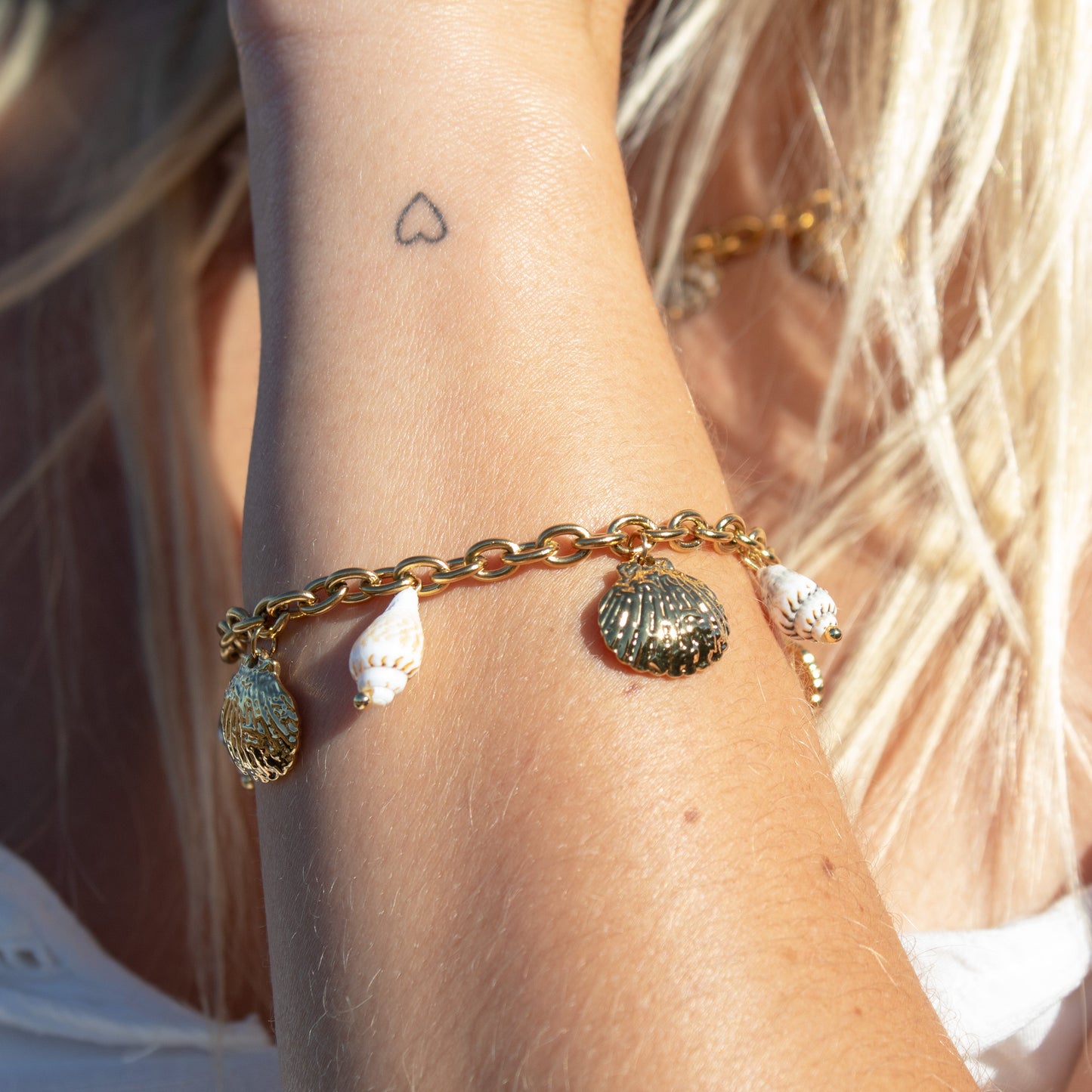 Gold bracelet with shell charms