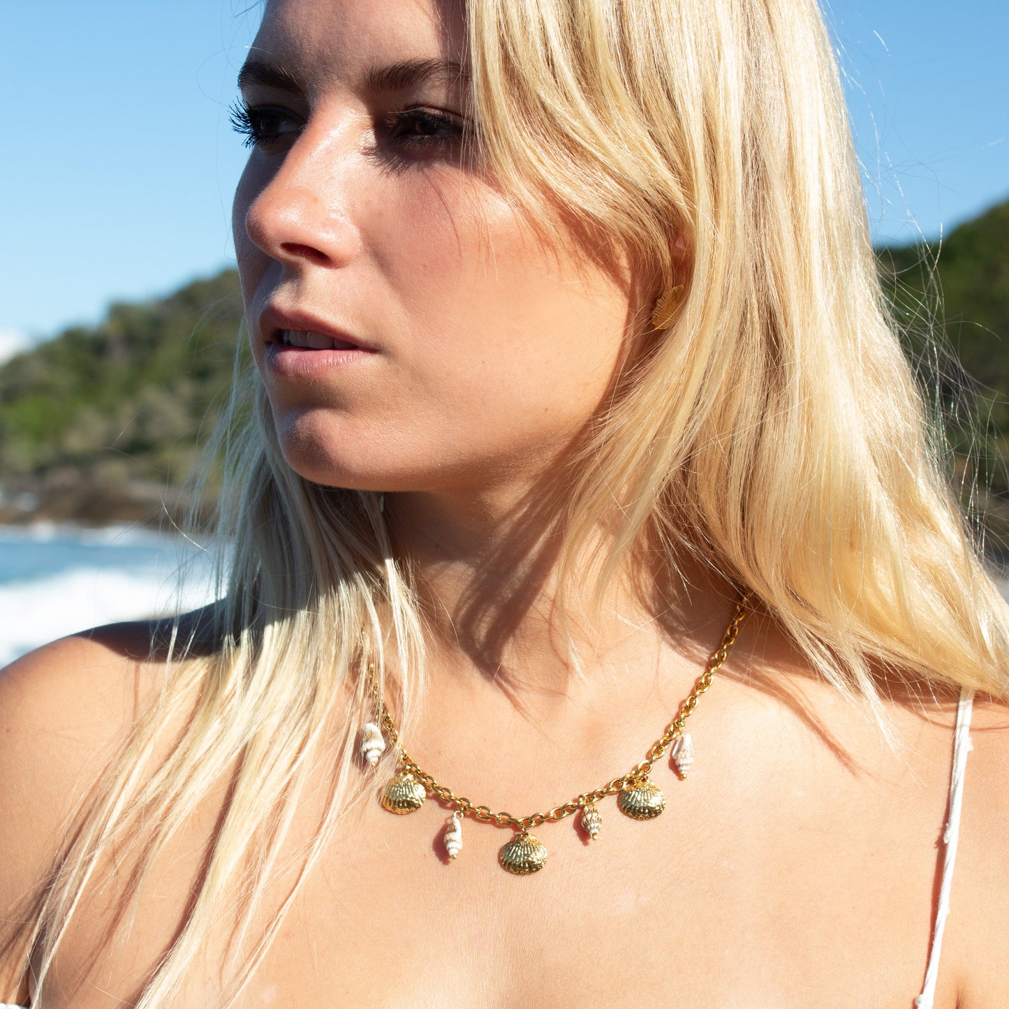 Gold necklace with seashell charms