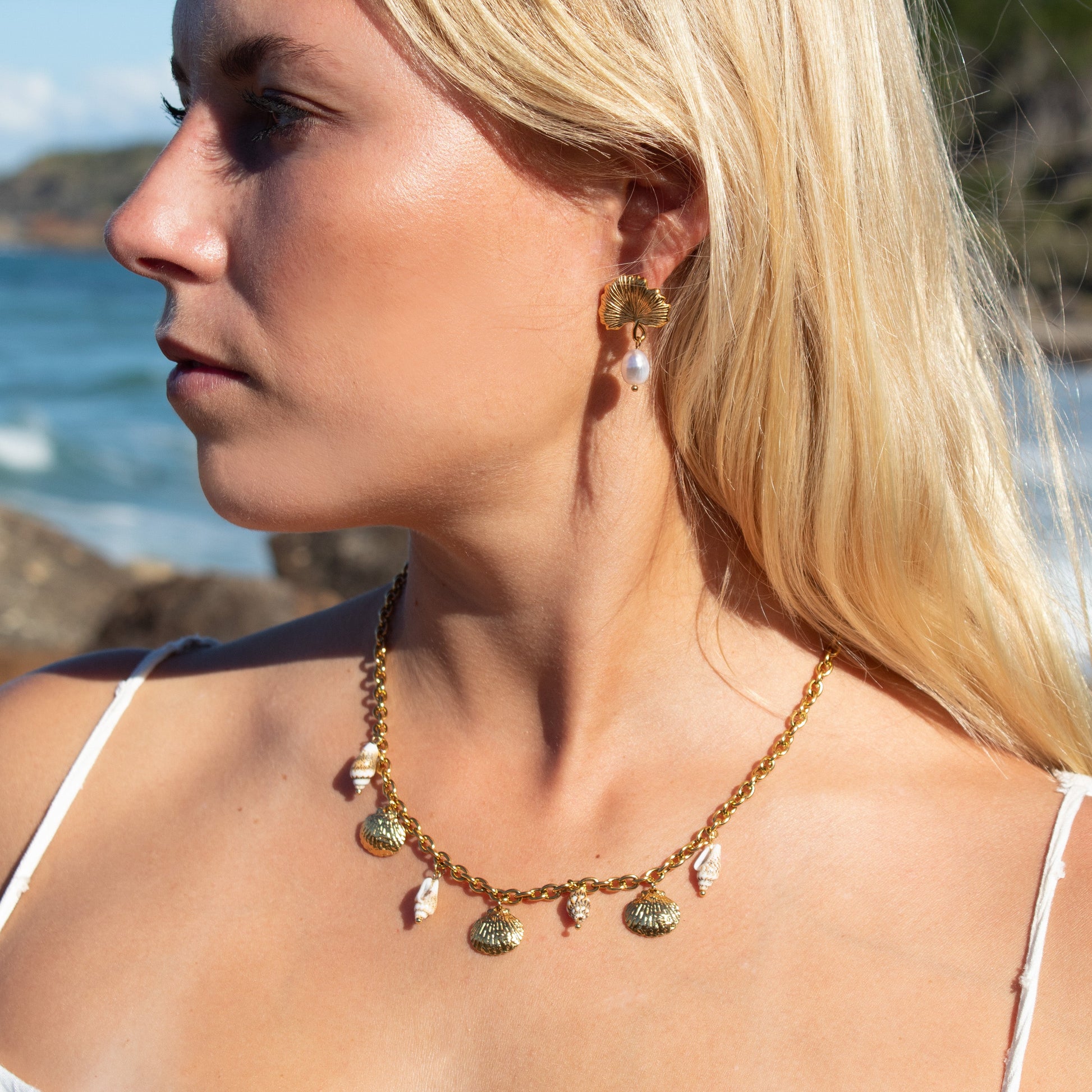 Gold seashell charm necklace