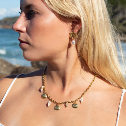 Gold seashell charm necklace