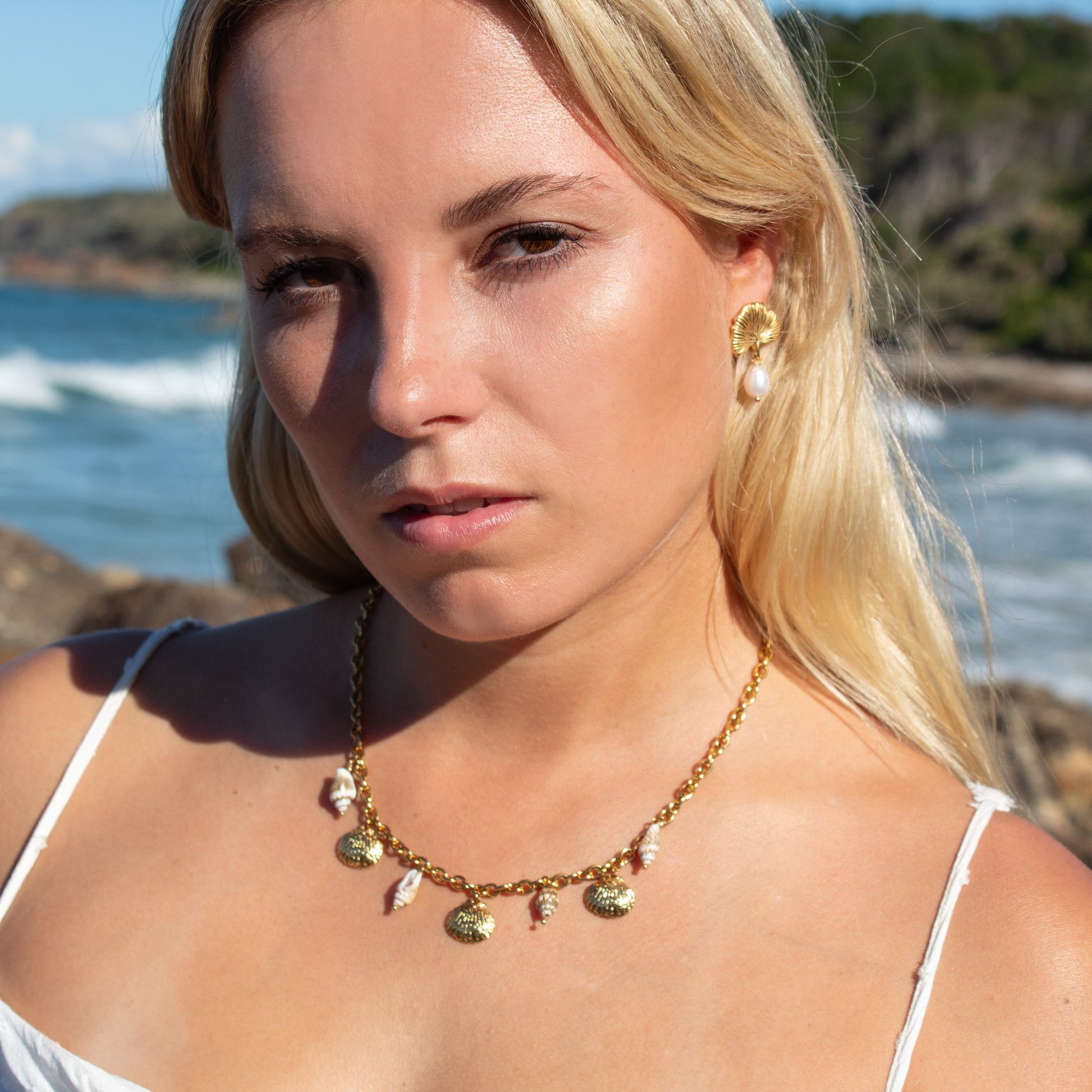 Gold necklace with shell charms