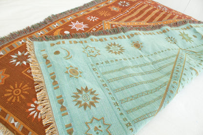 Reversible celestial blanket in rust and teal