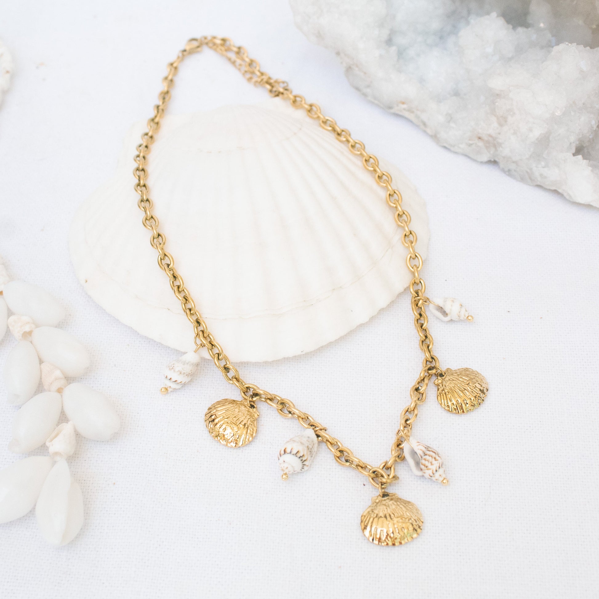 Gold necklace with seashell charms