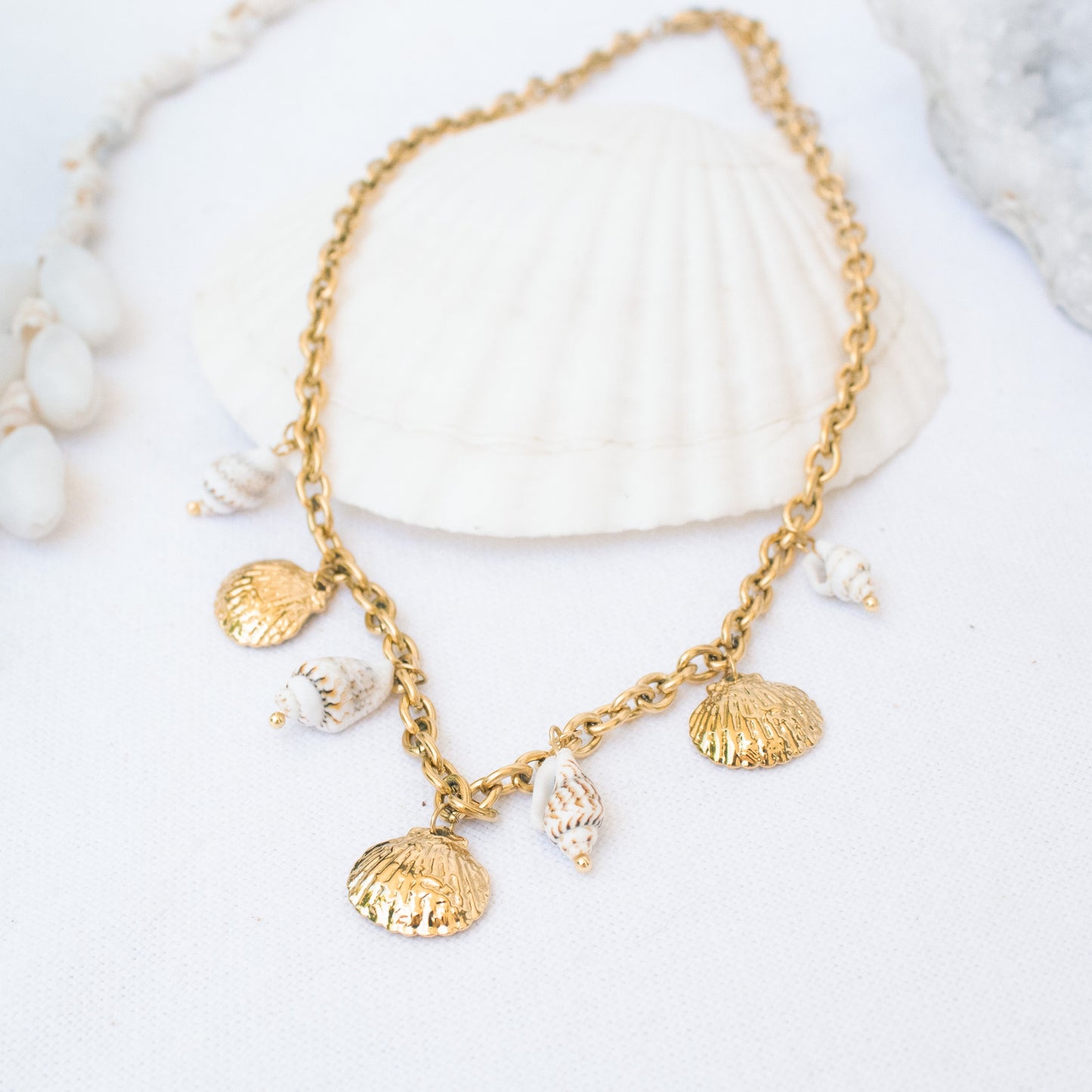 Gold necklace with seashell charms