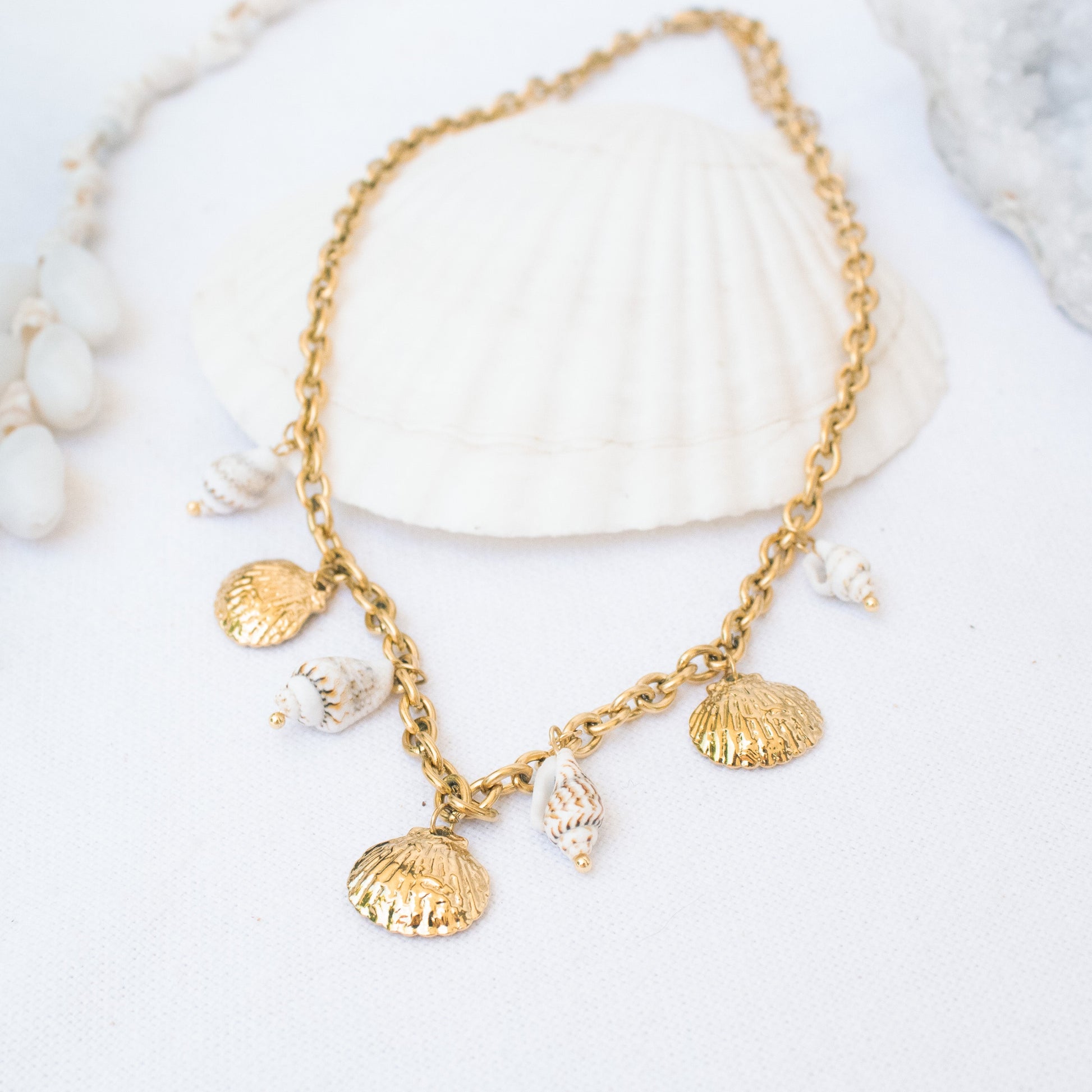 Gold necklace with seashell charms