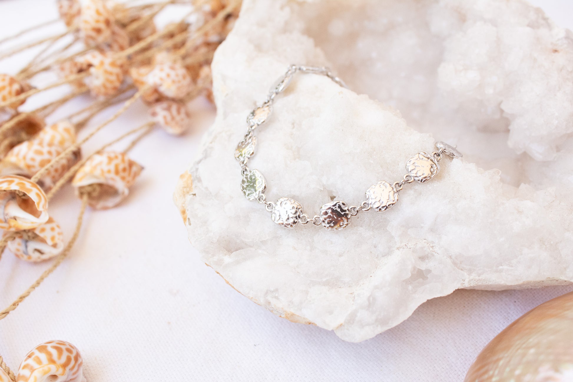 Essence Bracelet with textured silver charms