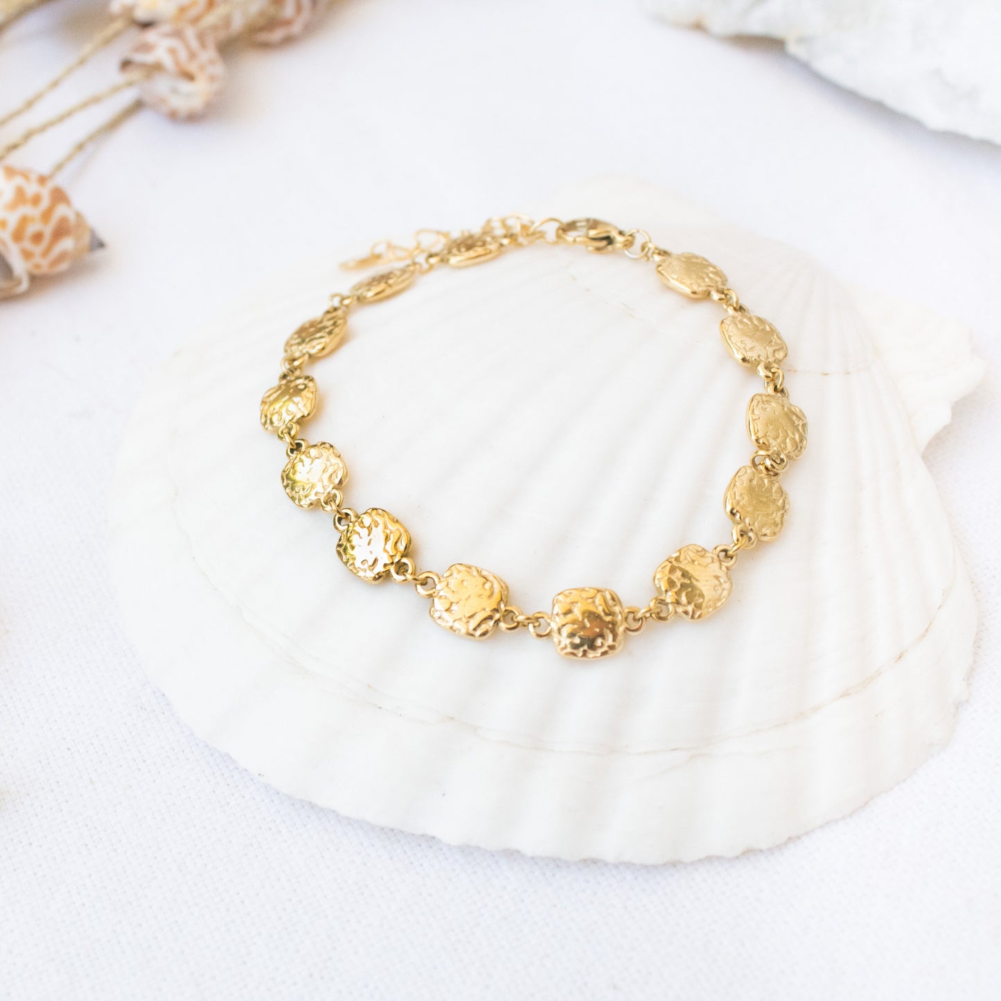 Gold Essence bracelet with hammered coin-shaped charms