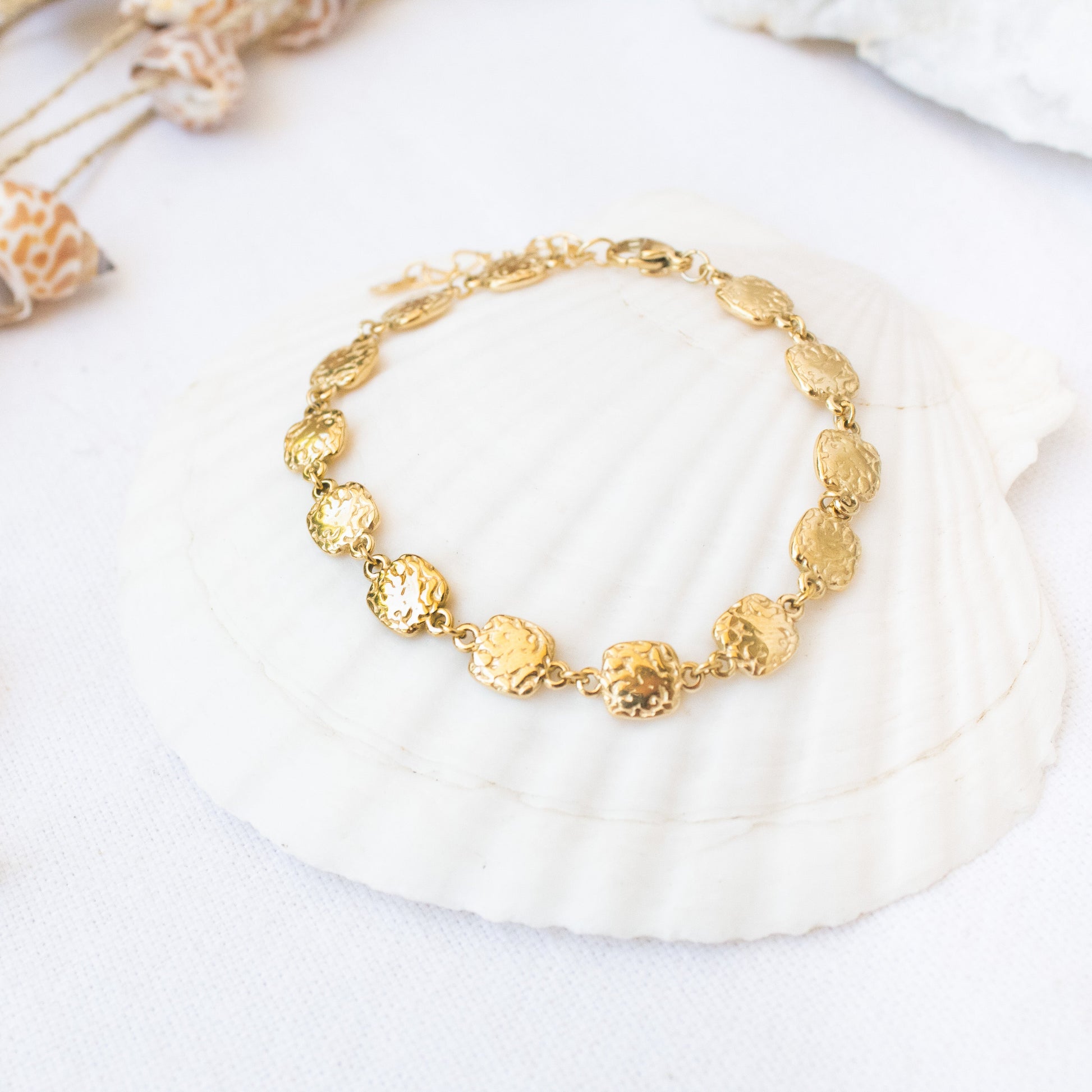 Gold Essence bracelet with hammered coin-shaped charms