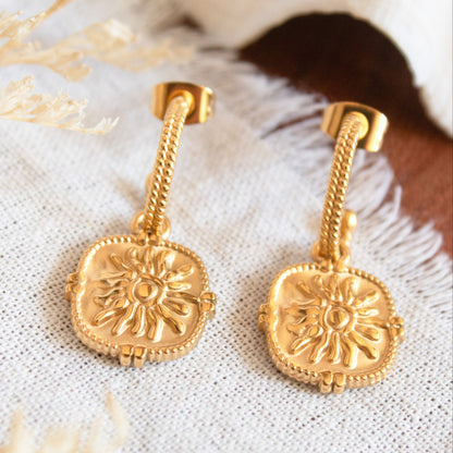 Gold sun medallion drop earrings