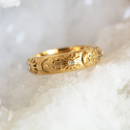 Gold celestial ring with sun, moon, and stars