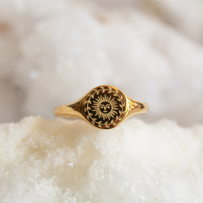 Gold sun signet ring with laurel wreath