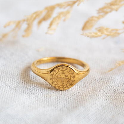 Gold sun face signet ring