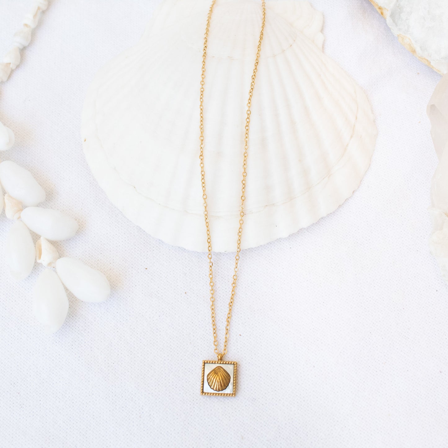 Gold Siren necklace with shell pendant