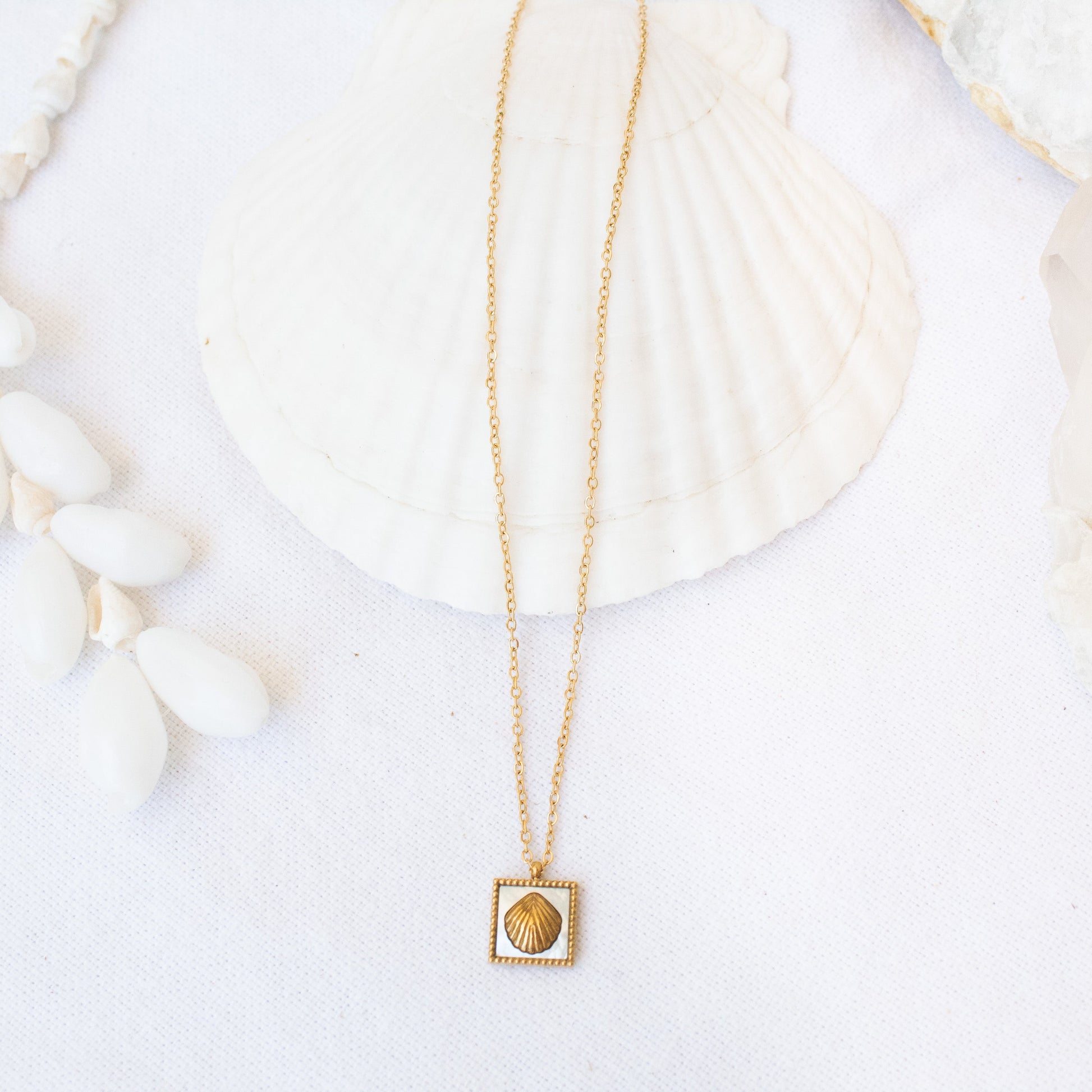 Gold Siren necklace with shell pendant