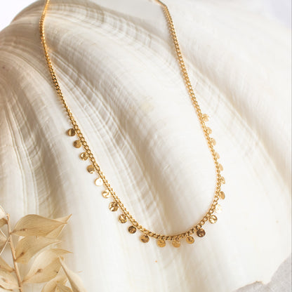 Gold necklace with small coin charms