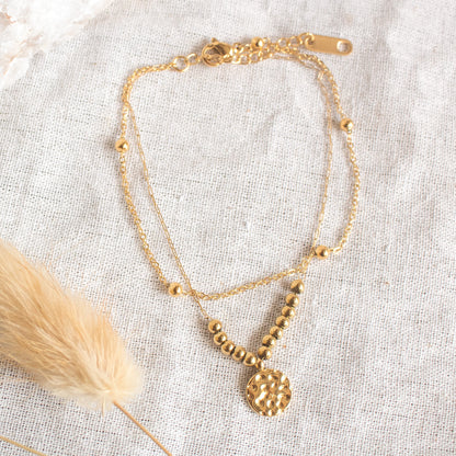 Gold layered anklet with coin charm