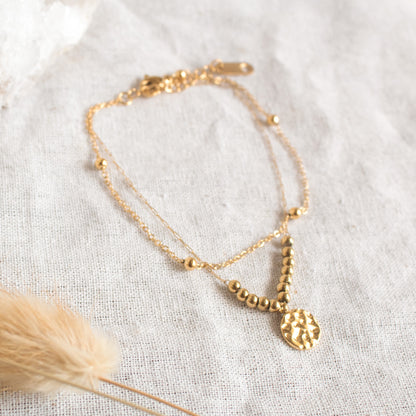 Gold double-layer bracelet with hammered pendant